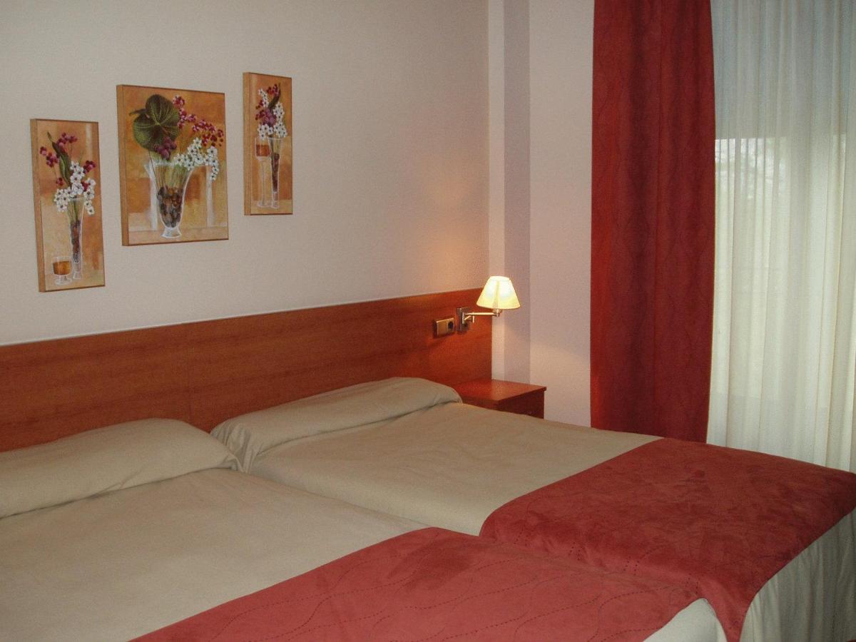 Cama o camas de una habitación en Balneario San Andres