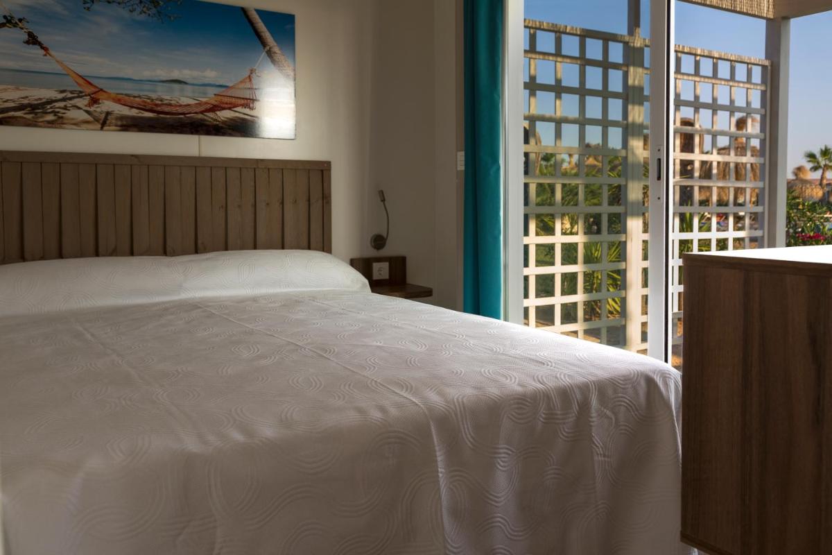 Cama o camas de una habitación en Alannia Costa Blanca