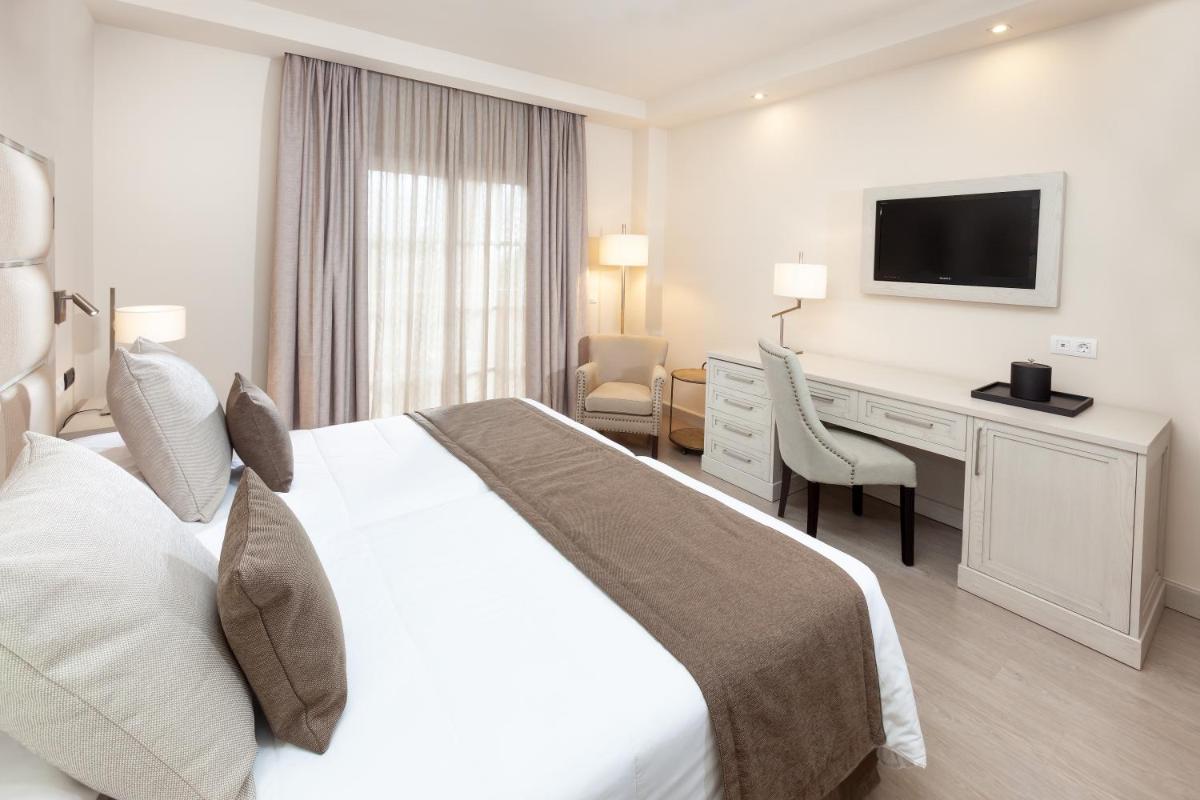 Cama o camas de una habitación en Hotel RIU Garoé