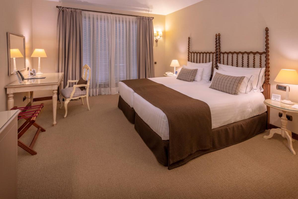Cama o camas de una habitación en Gran Hotel Rey Don Jaime