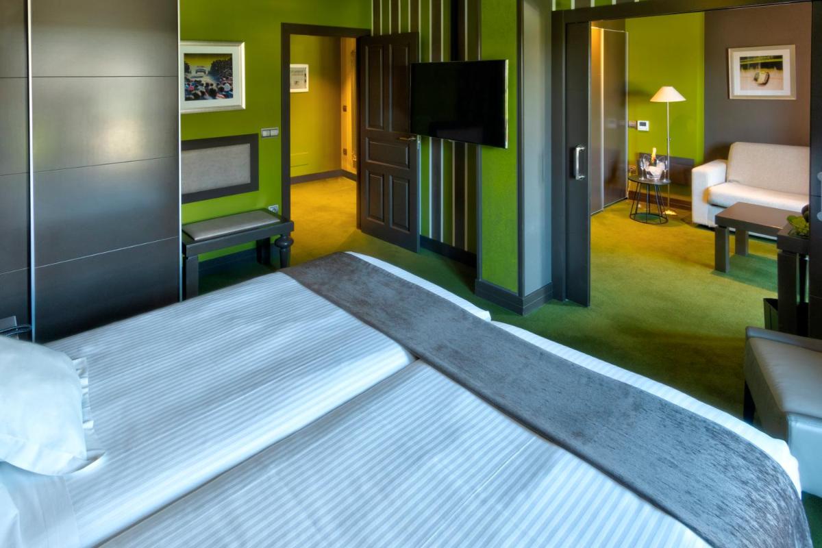 Cama o camas de una habitación en Costa Esmeralda Suites