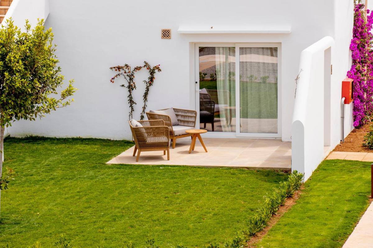 Jardín al aire libre en Eques Petit Resort