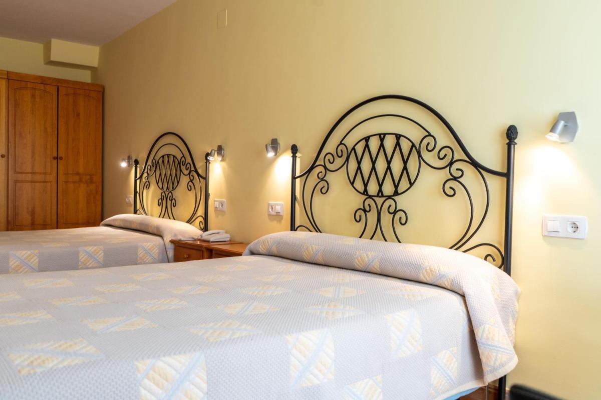 Cama o camas de una habitación en Hotel Castellote