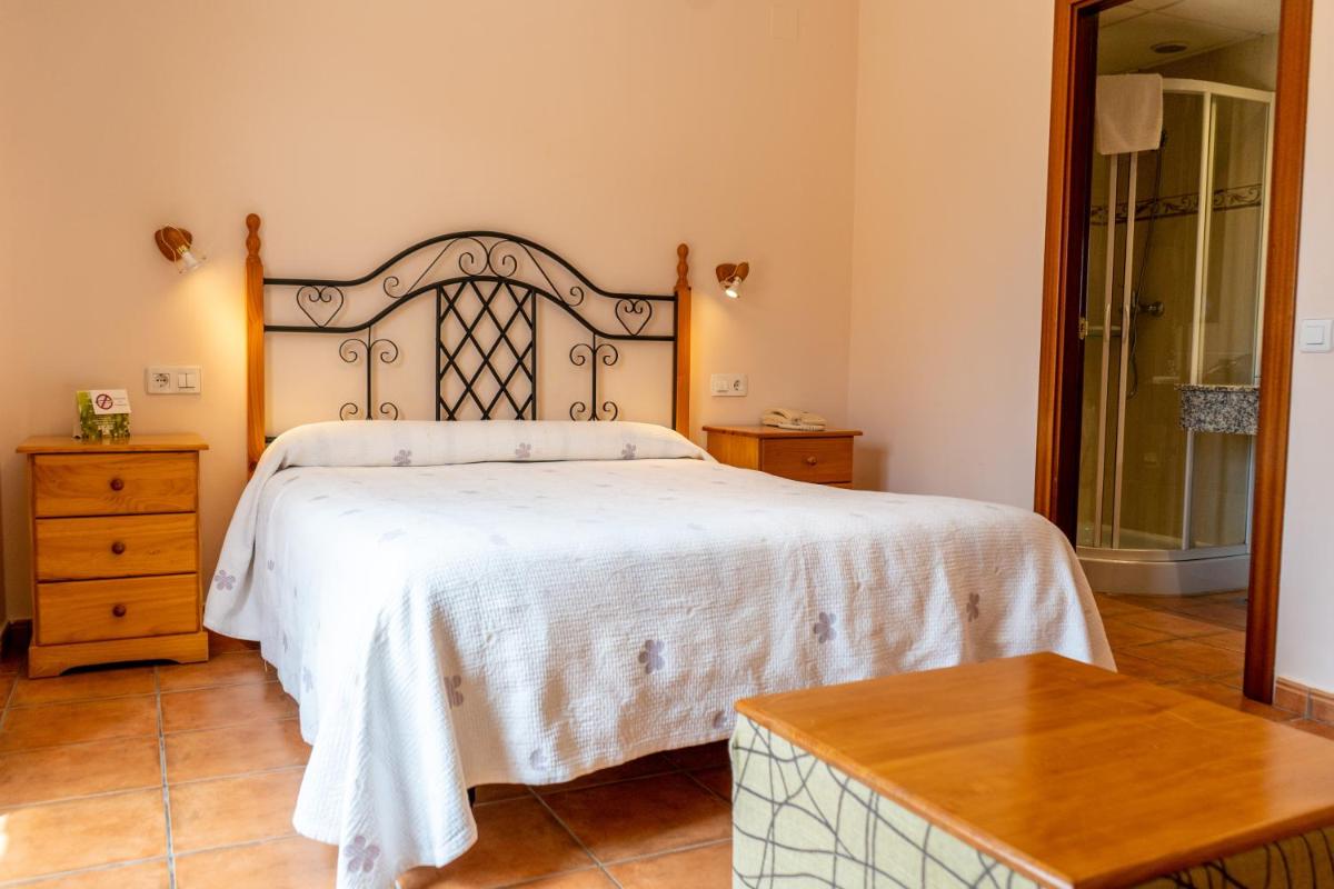 Cama o camas de una habitación en Hotel Castellote