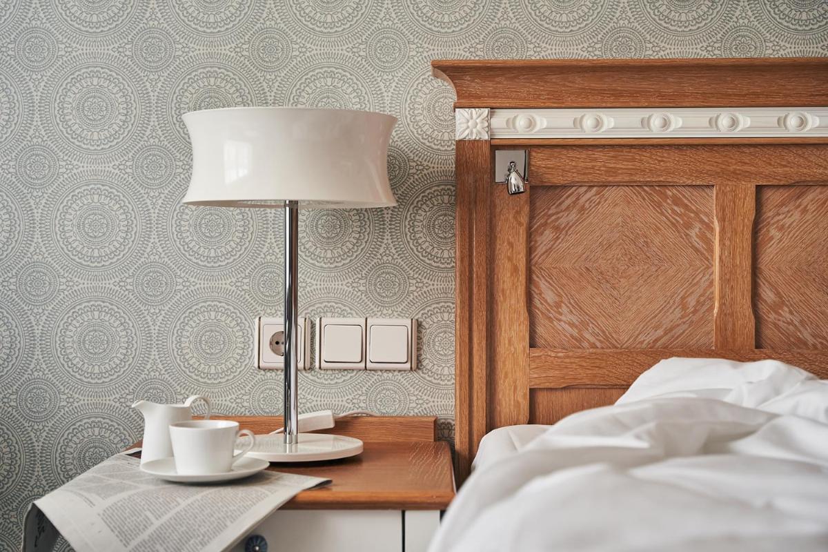 Ein Bett oder Betten in einem Zimmer der Unterkunft A-ROSA Kurhaus Binz