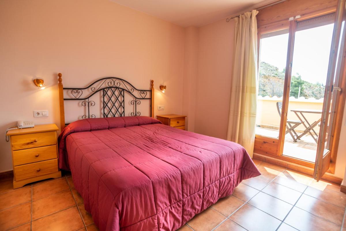 Cama o camas de una habitación en Hotel Castellote
