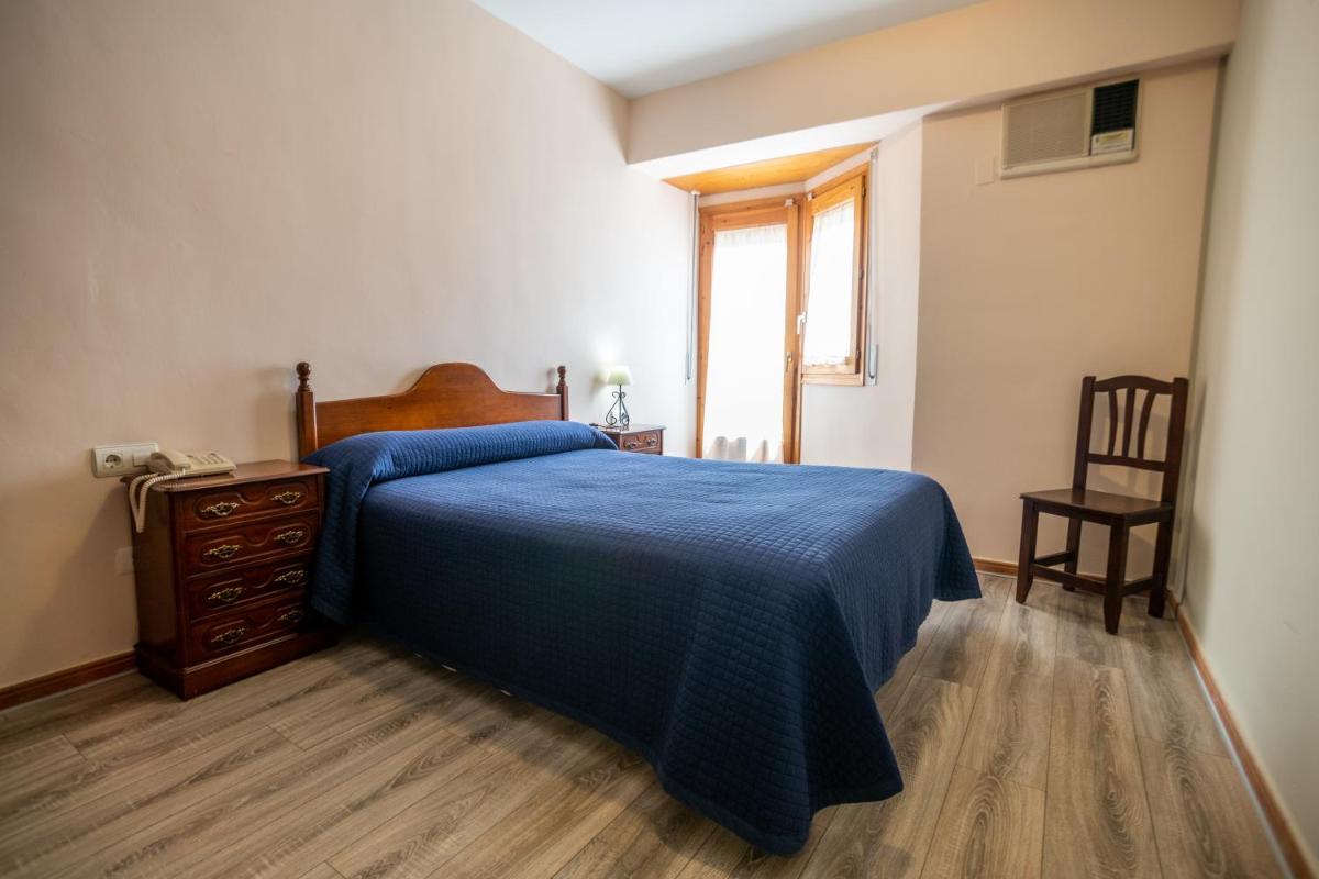 Cama o camas de una habitación en Hotel Castellote