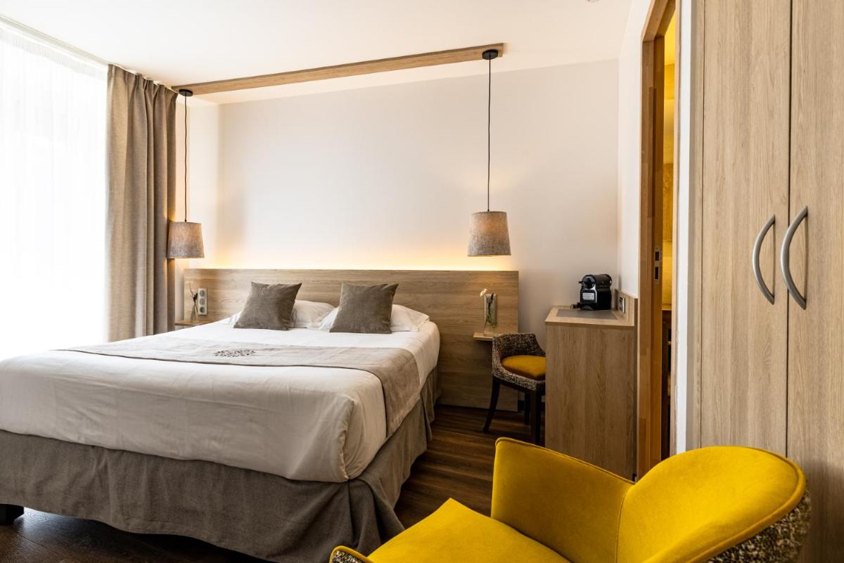 Un ou plusieurs lits dans un hébergement de l'établissement Hôtel SPA du Lac de Madine - Maison DRAPIER