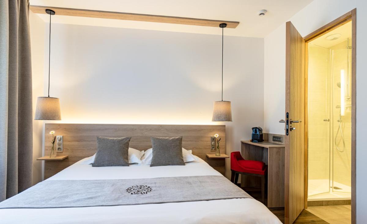 Un ou plusieurs lits dans un hébergement de l'établissement Hôtel SPA du Lac de Madine - Maison DRAPIER