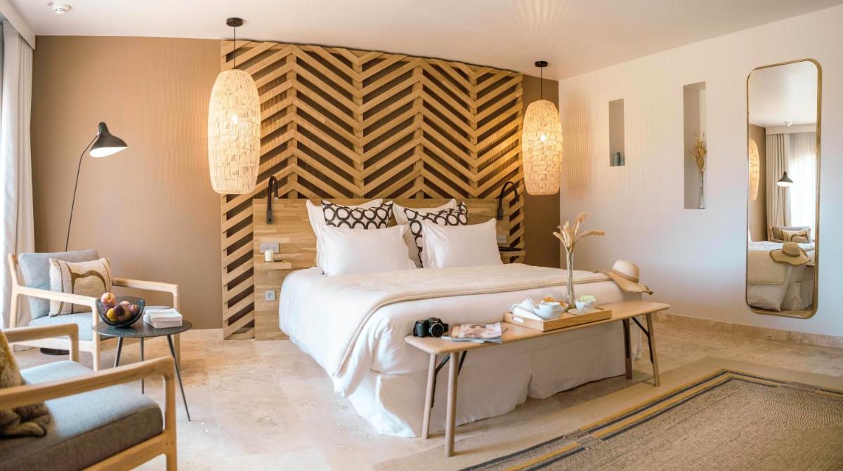 Un ou plusieurs lits dans un hébergement de l'établissement Château L'Hospitalet Wine Resort Beach & Spa