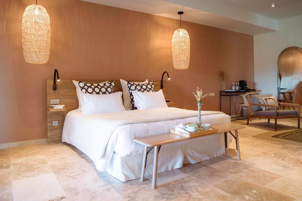 Un ou plusieurs lits dans un hébergement de l'établissement Château L'Hospitalet Wine Resort Beach & Spa