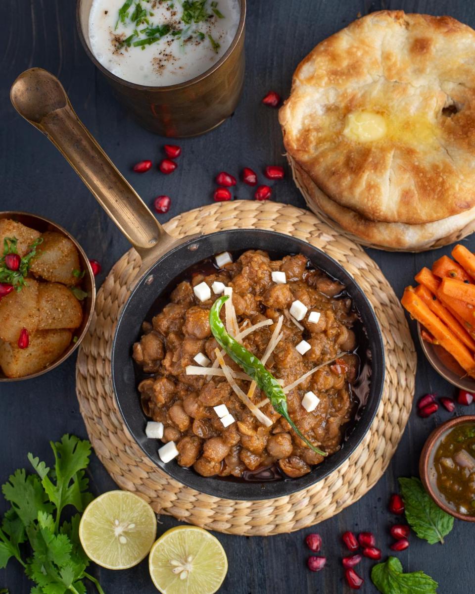 a bowl of food with beans and a pie at Crowne Plaza New Delhi Rohini by IHG in New Delhi a bowl of food with beans and a pie at Crowne Plaza New Delhi Rohini by IHG in New Delhi