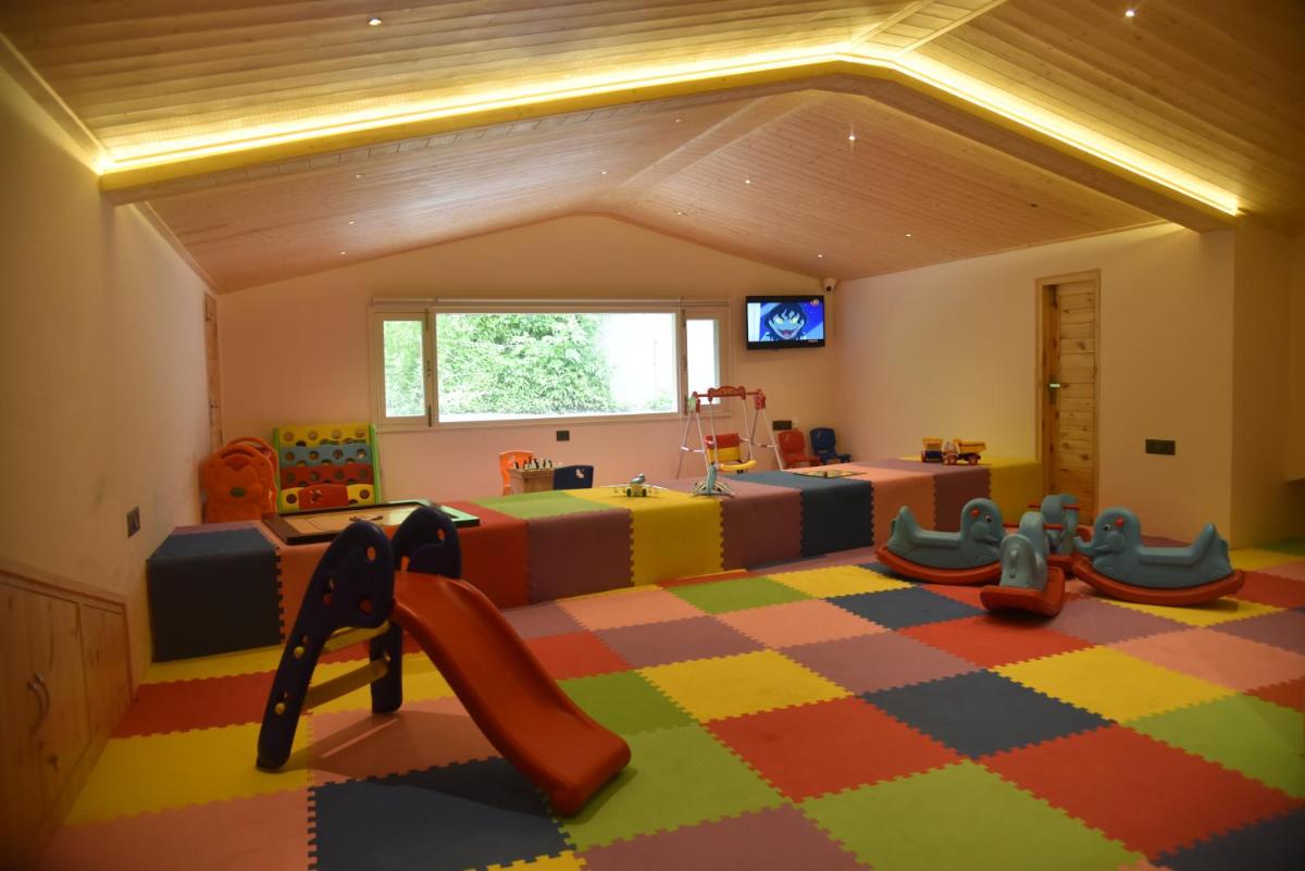 a large room with a play room with a play floor at The Orchid Shimla in Shimla