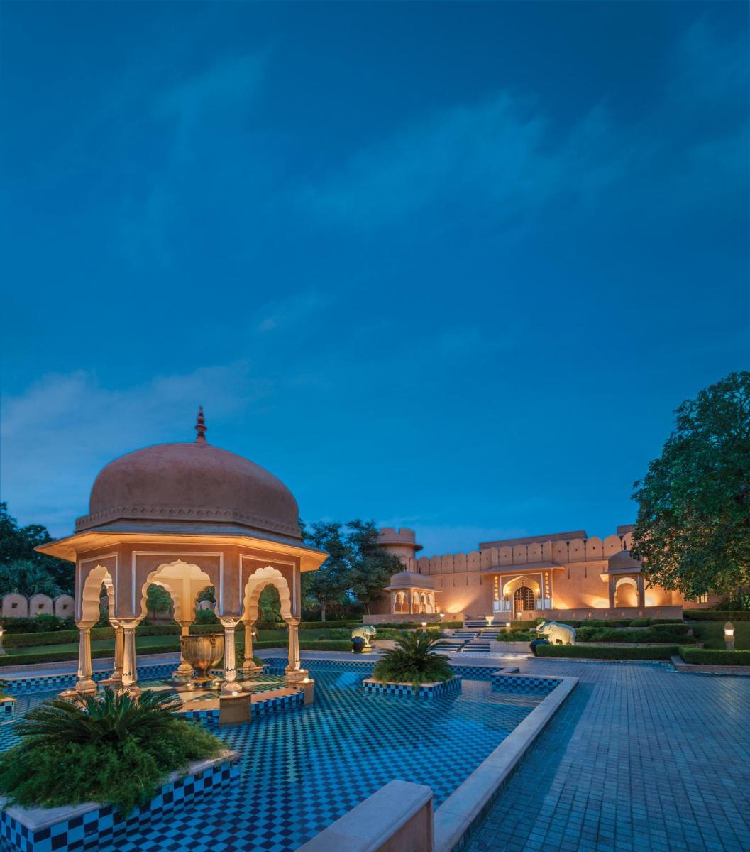 a gazebo in front of a building at night at The Oberoi Rajvilas Jaipur in Jaipur