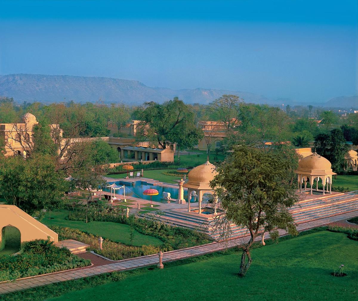 an aerial view of a resort with a swimming pool at The Oberoi Rajvilas Jaipur in Jaipur