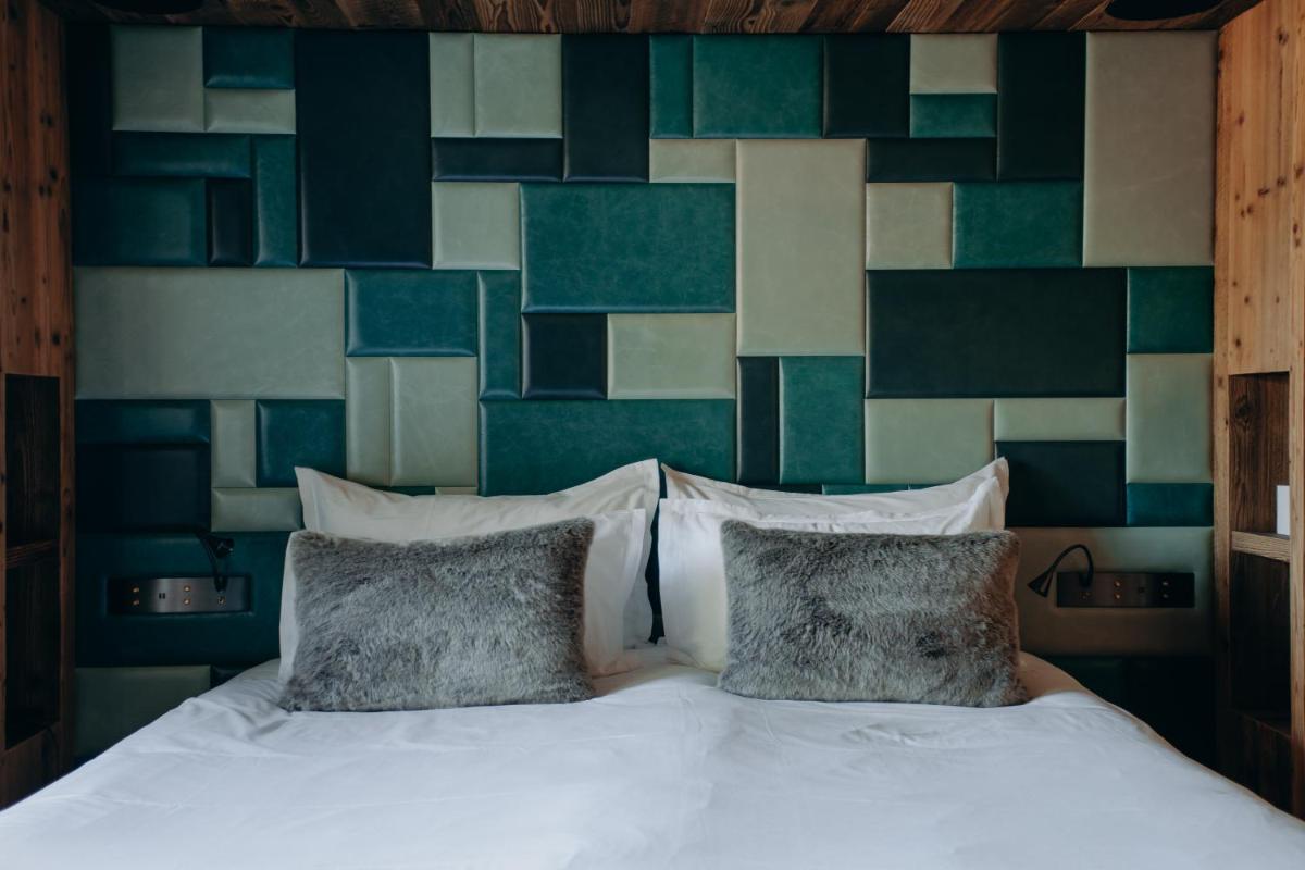 Un ou plusieurs lits dans un hébergement de l'établissement Armancette - The Leading Hotels of the World