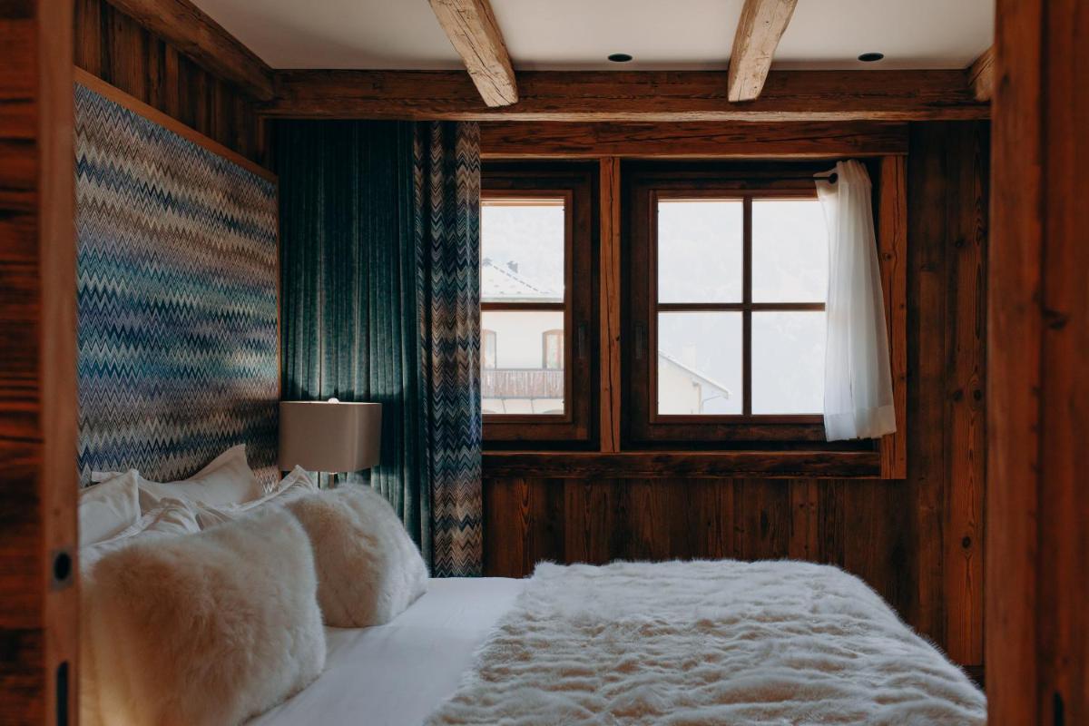 Un ou plusieurs lits dans un hébergement de l'établissement Armancette - The Leading Hotels of the World