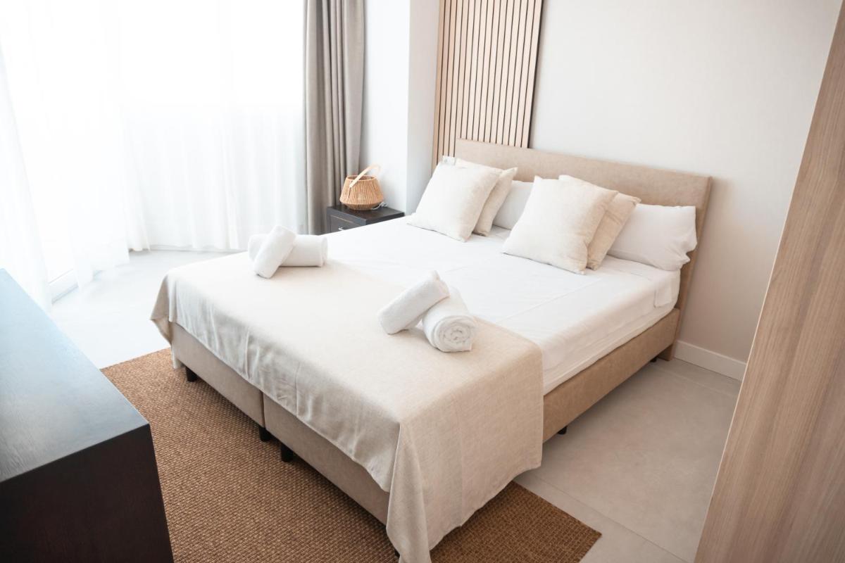 Cama o camas de una habitación en Portomar Apartments - 4-Star Superior Hotel