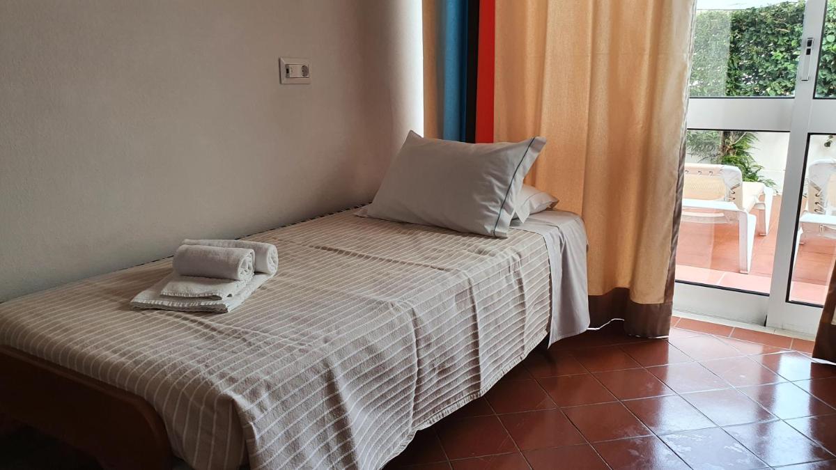 Uma cama ou camas num quarto em Hotel do Cerro