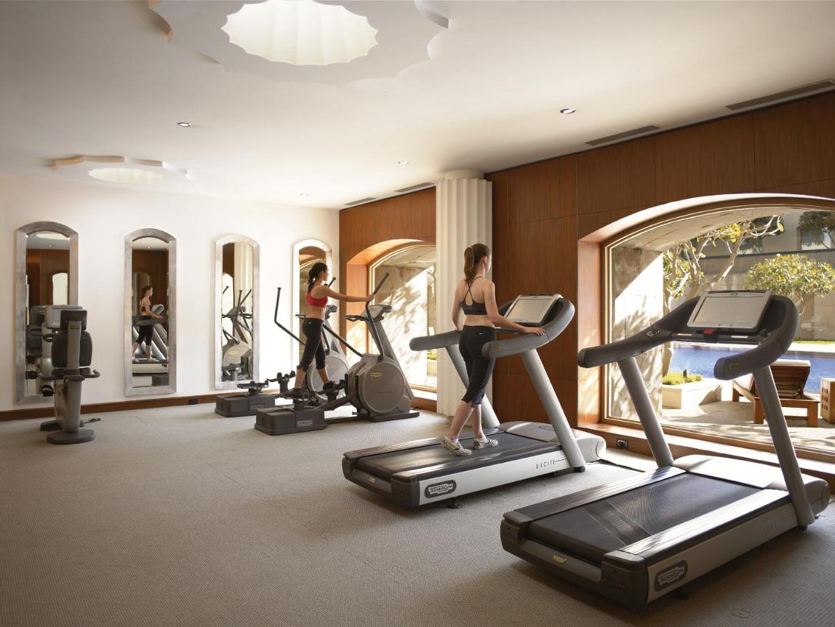 a group of people exercising on treadmills in a gym at Trident Gurgaon in Gurgaon