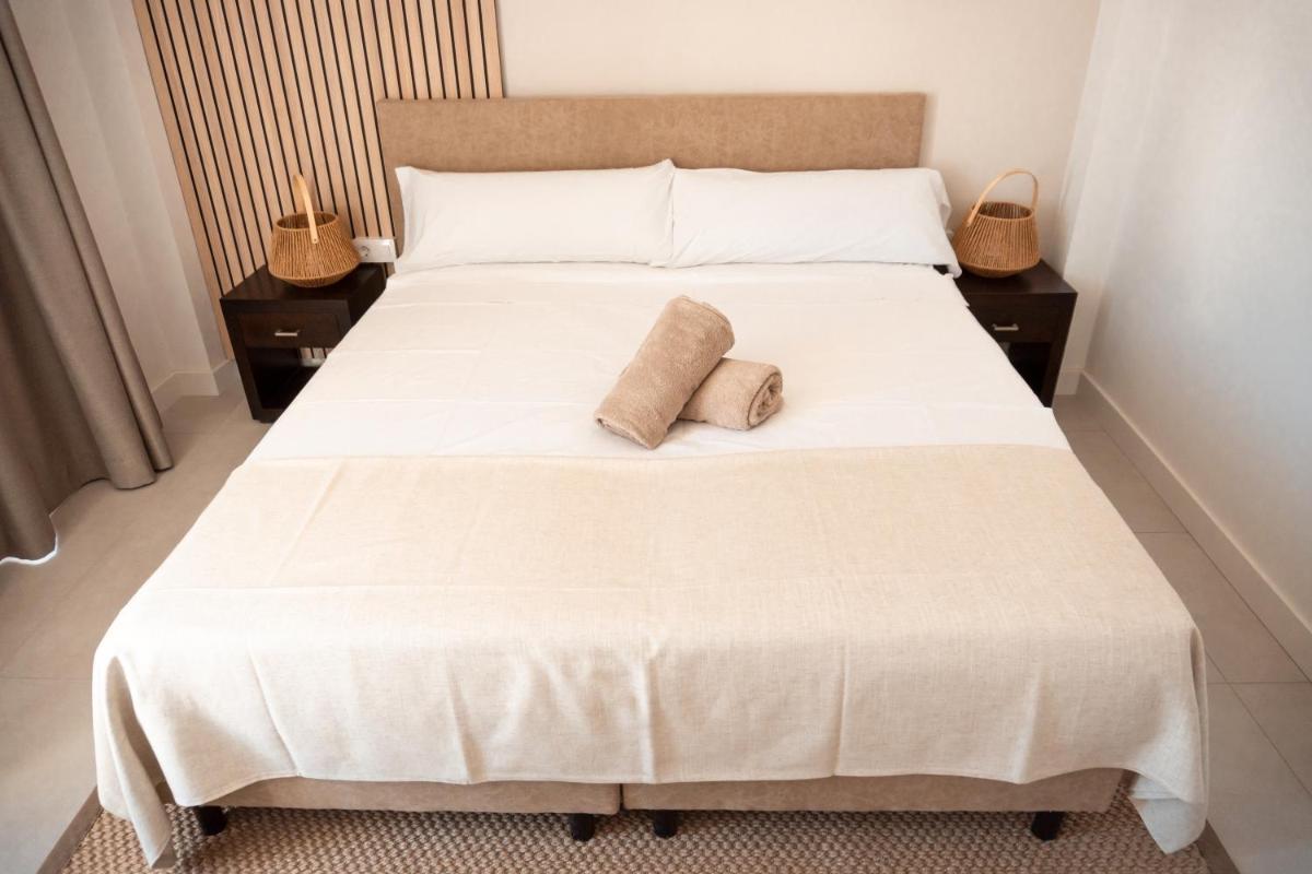 Cama o camas de una habitación en Portomar Apartments - 4-Star Superior Hotel