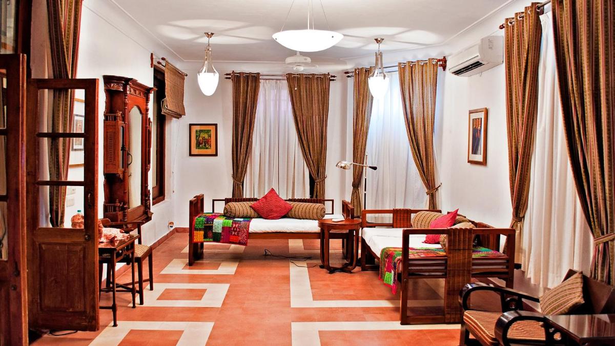 a living room with a couch and a table at Neemrana Fort-Palace in Neemrana