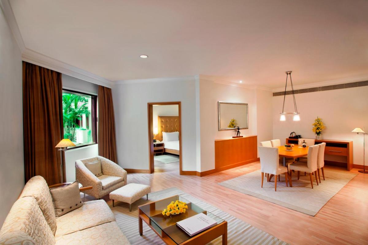 a living room with a couch and a table at Trident Chennai in Chennai