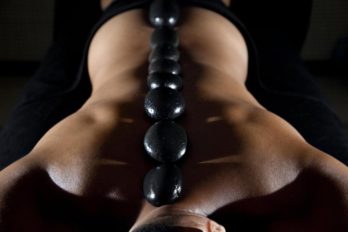 a woman wearing a black rosary on her back at Hard Rock Hotel Goa Calangute in Calangute