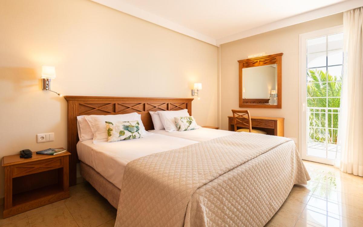 Cama o camas de una habitación en Inturotel Sa Marina