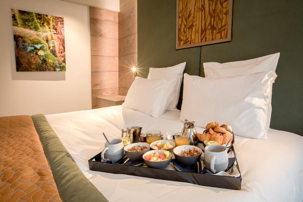 Un ou plusieurs lits dans un hébergement de l'établissement Rivage Hôtel & Spa Annecy