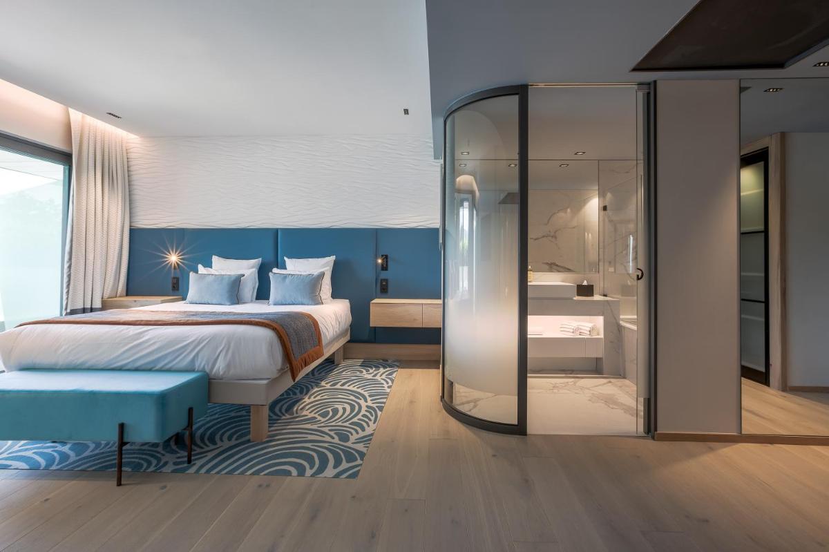 Un ou plusieurs lits dans un hébergement de l'établissement Rivage Hôtel & Spa Annecy