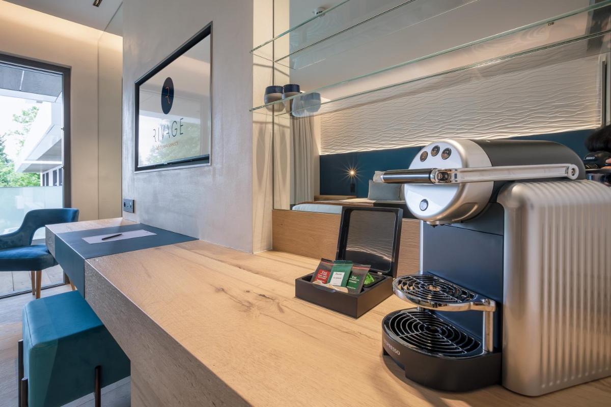 Télévision ou salle de divertissement dans l'établissement Rivage Hôtel & Spa Annecy
