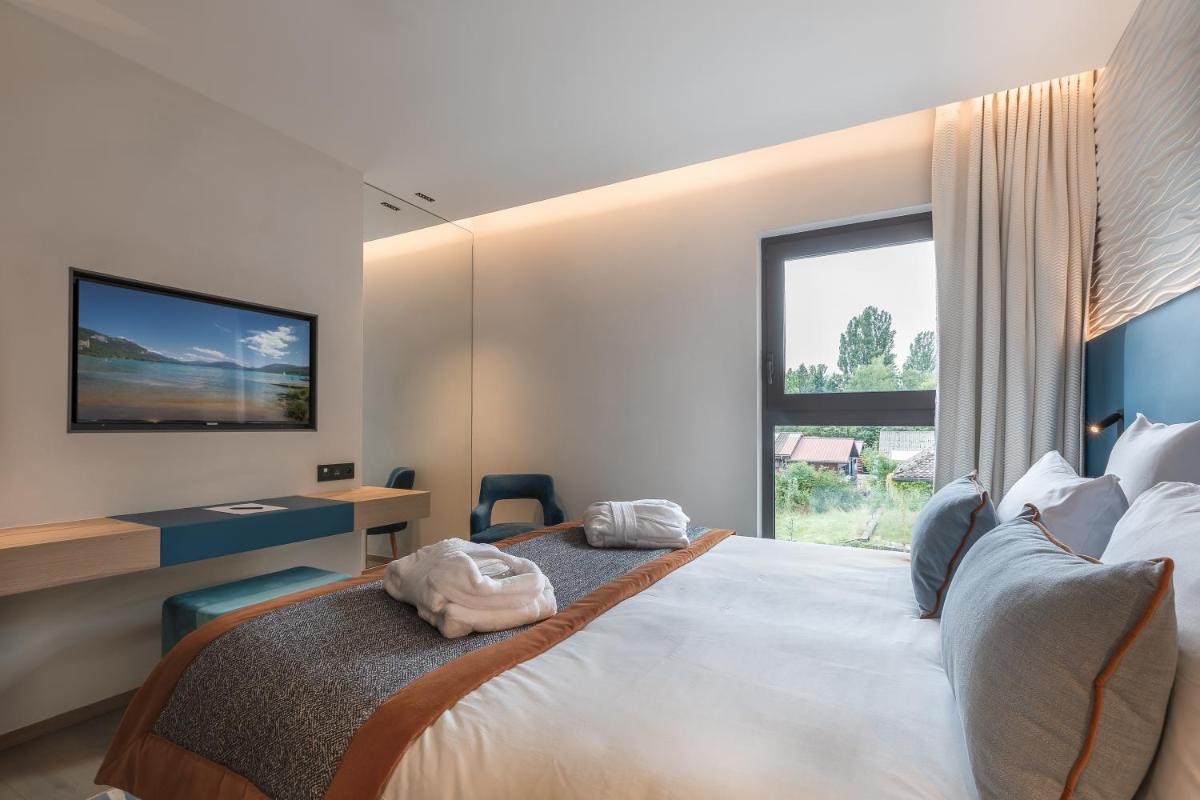 Un ou plusieurs lits dans un hébergement de l'établissement Rivage Hôtel & Spa Annecy