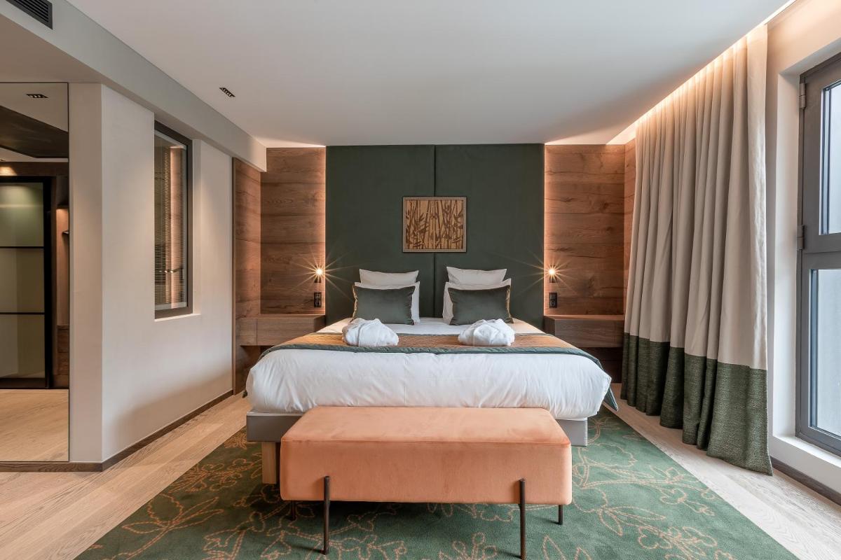 Un ou plusieurs lits dans un hébergement de l'établissement Rivage Hôtel & Spa Annecy
