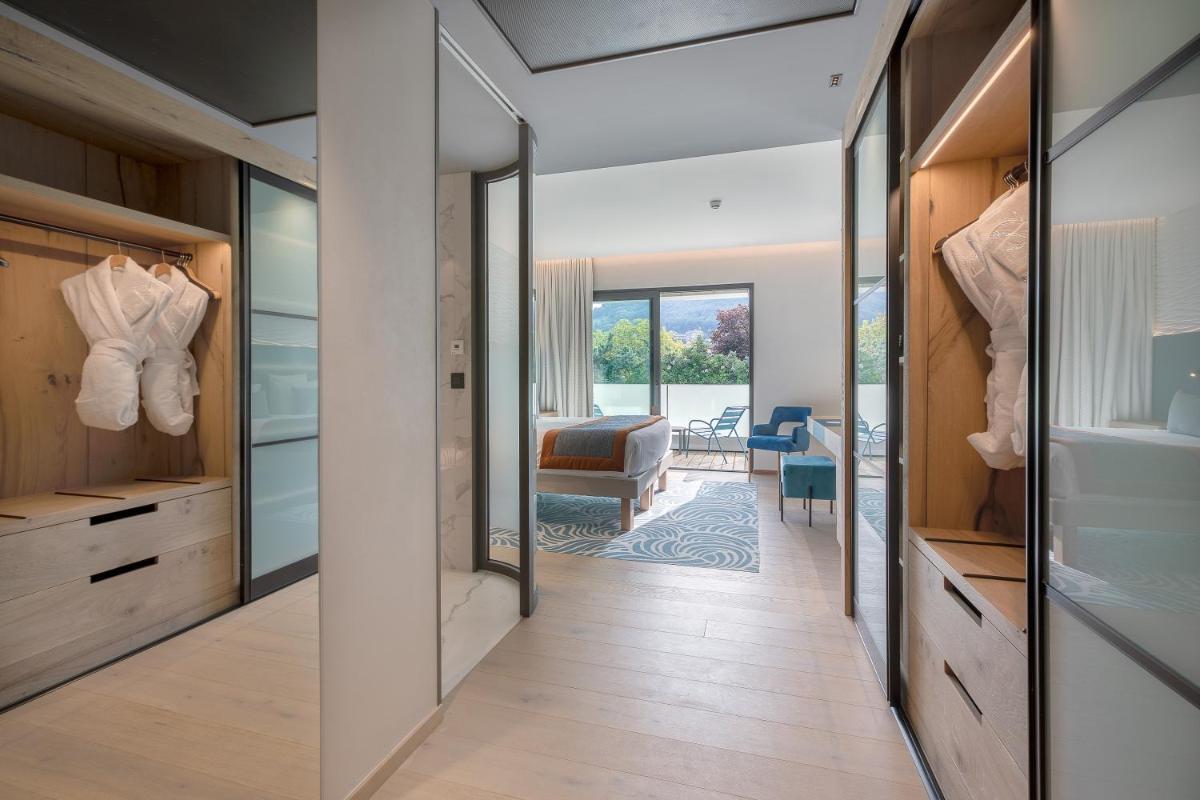 Un ou plusieurs lits dans un hébergement de l'établissement Rivage Hôtel & Spa Annecy