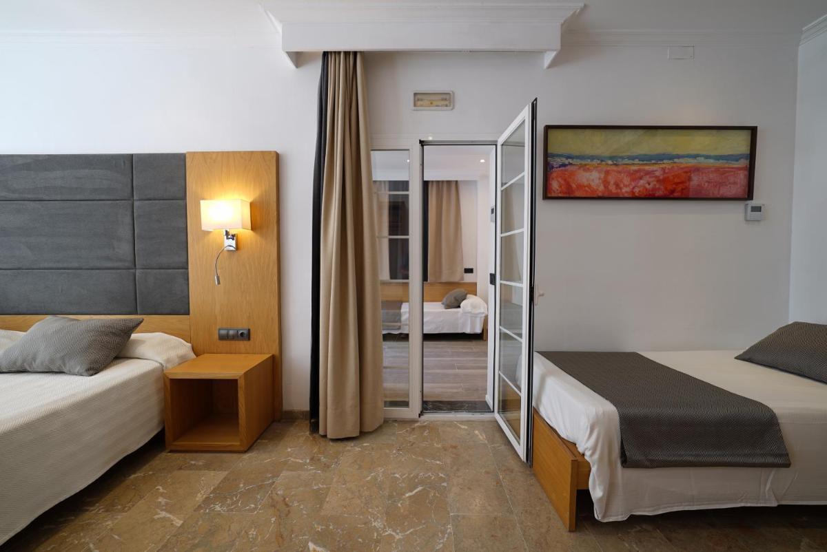 Cama o camas de una habitación en Hotel Artmadams
