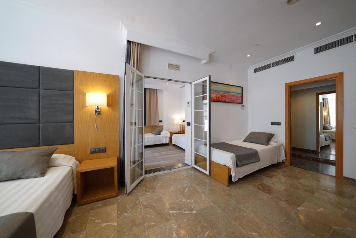 Cama o camas de una habitación en Hotel Artmadams