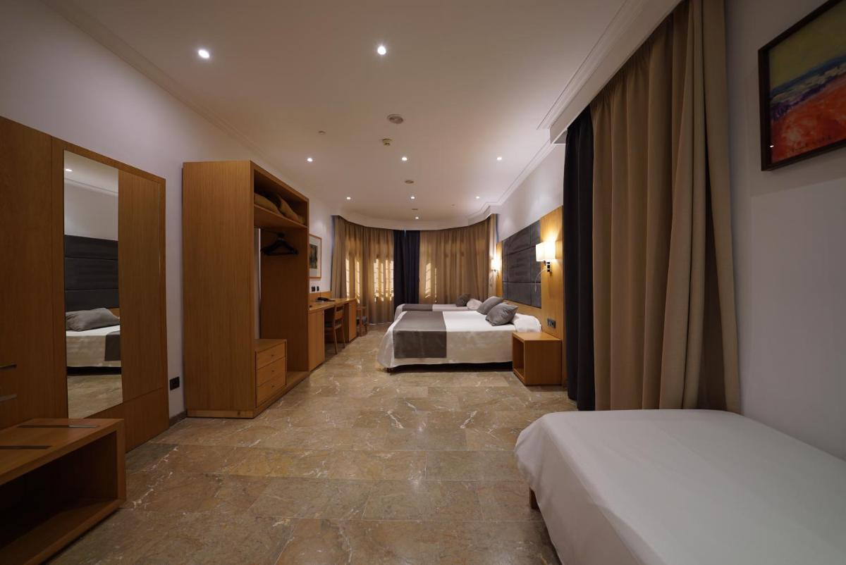Cama o camas de una habitación en Hotel Artmadams