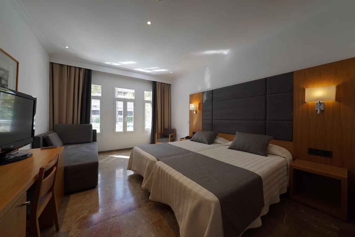 Cama o camas de una habitación en Hotel Artmadams