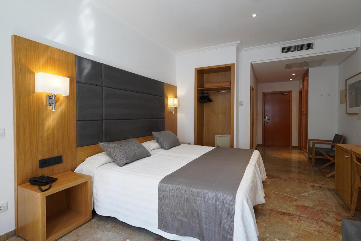 Cama o camas de una habitación en Hotel Artmadams
