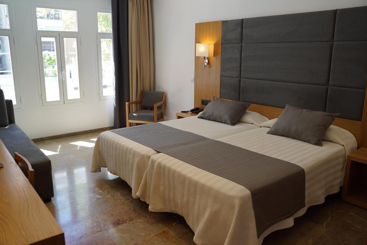 Cama o camas de una habitación en Hotel Artmadams