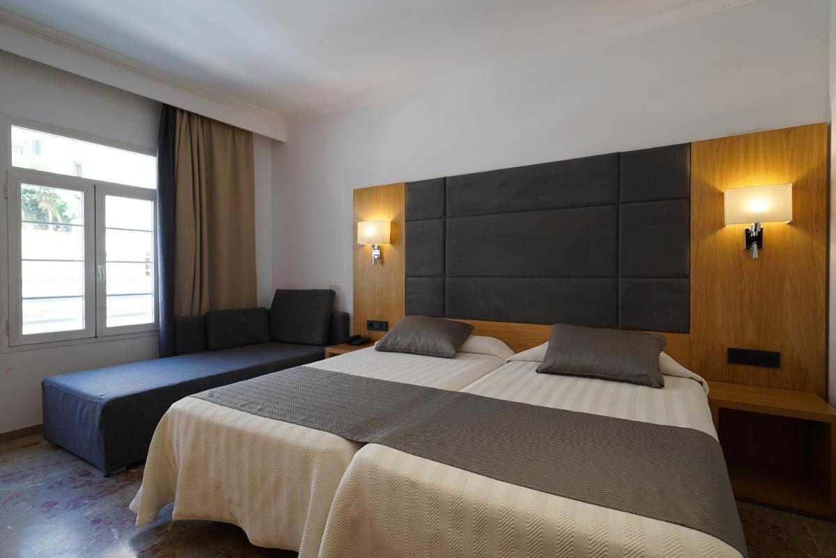 Cama o camas de una habitación en Hotel Artmadams