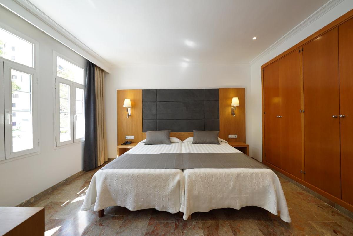Cama o camas de una habitación en Hotel Artmadams