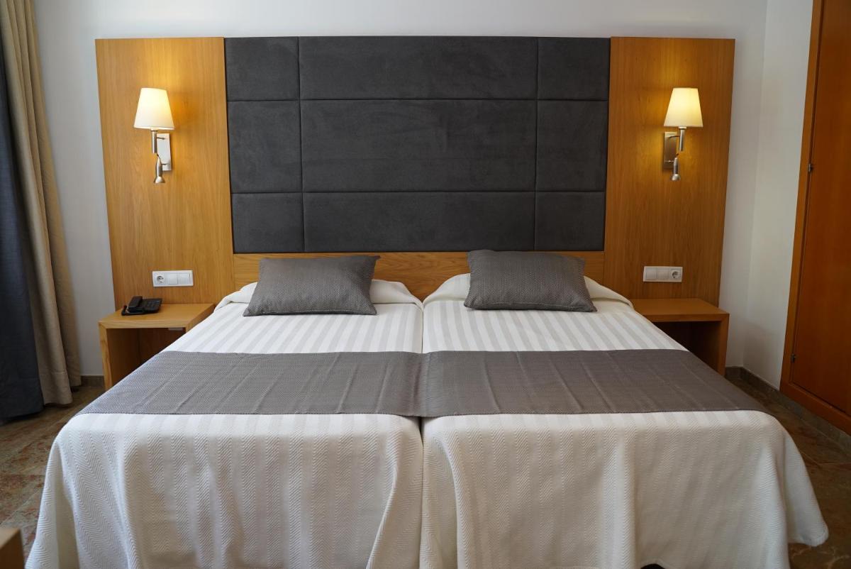 Cama o camas de una habitación en Hotel Artmadams