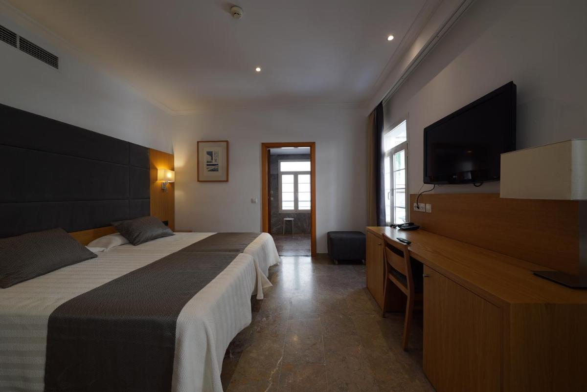 Cama o camas de una habitación en Hotel Artmadams