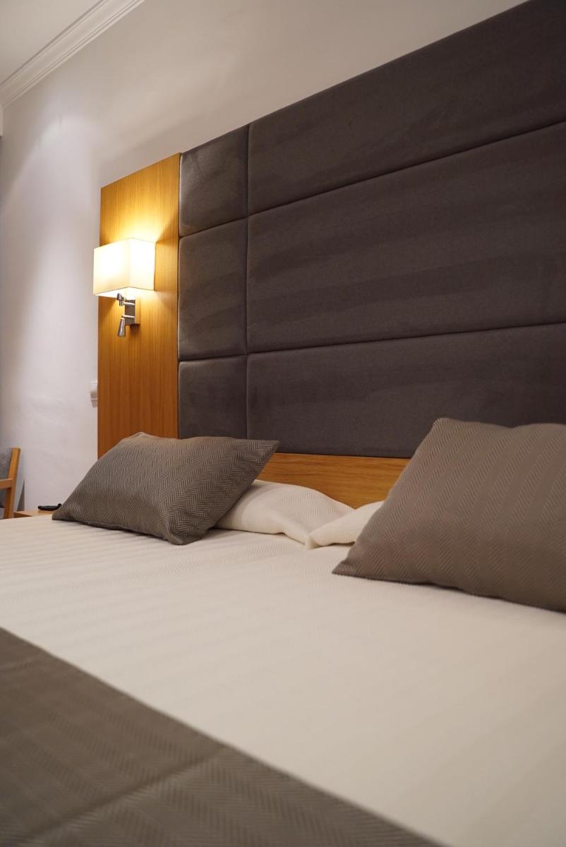 Cama o camas de una habitación en Hotel Artmadams