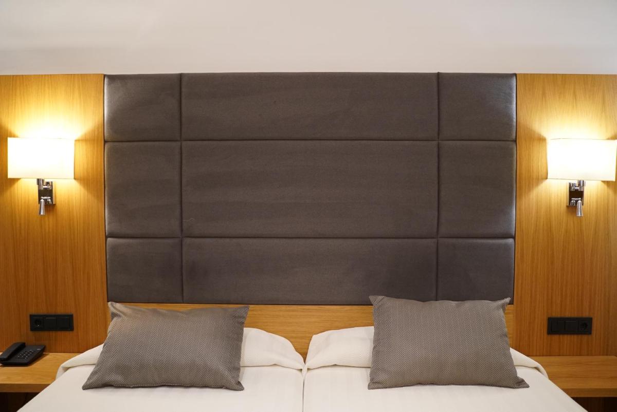 Cama o camas de una habitación en Hotel Artmadams