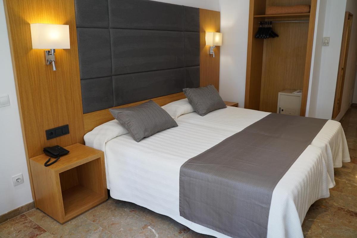 Cama o camas de una habitación en Hotel Artmadams