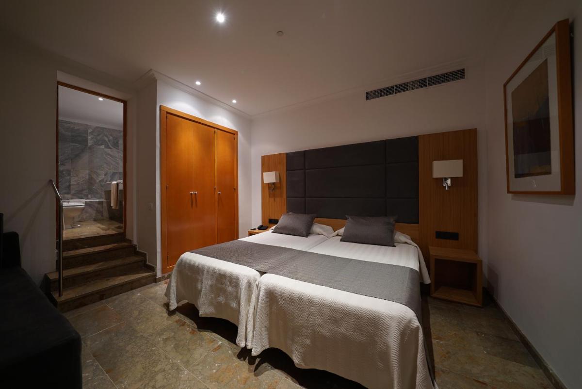 Cama o camas de una habitación en Hotel Artmadams