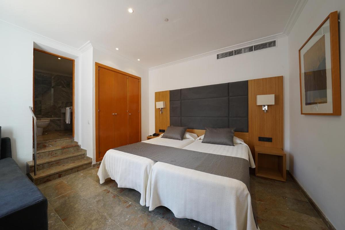 Cama o camas de una habitación en Hotel Artmadams